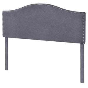 camelback nail trimmed upholstered king headboard in charcoal gray