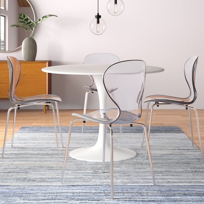 LeisureMod Oyster Dining Side Chair With Strong Metal Legs in Clear