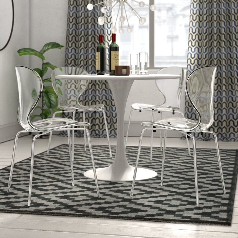 LeisureMod Oyster Dining Side Chair With Strong Metal Legs in Clear