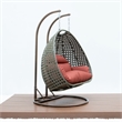 LeisureMod Outdoor Beige Wicker Hanging Double Egg Swing Chair in Dark Orange