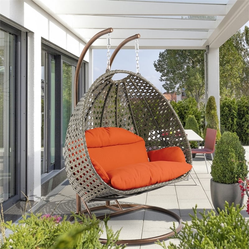 LeisureMod Outdoor Beige Wicker Hanging Double Egg Swing Chair in Orange