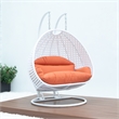 LeisureMod Outdoor White Wicker Hanging Double Egg Swing Chair in Orange