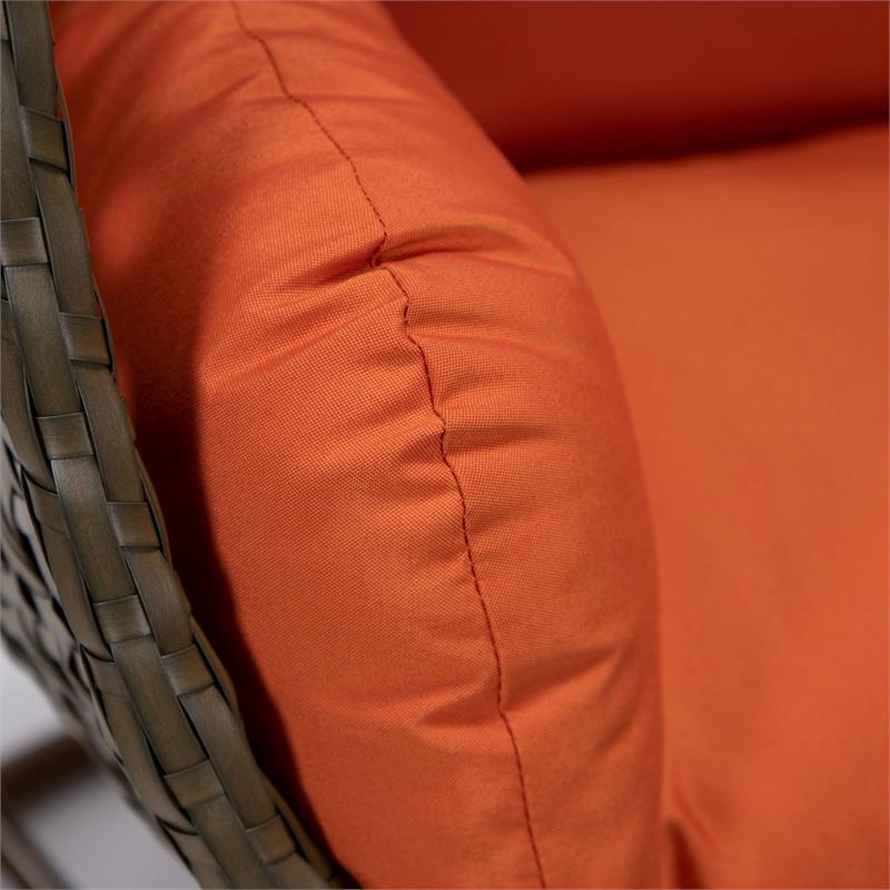 LeisureMod Beige Wicker Patio Egg Swing Chair with Stand in Orange