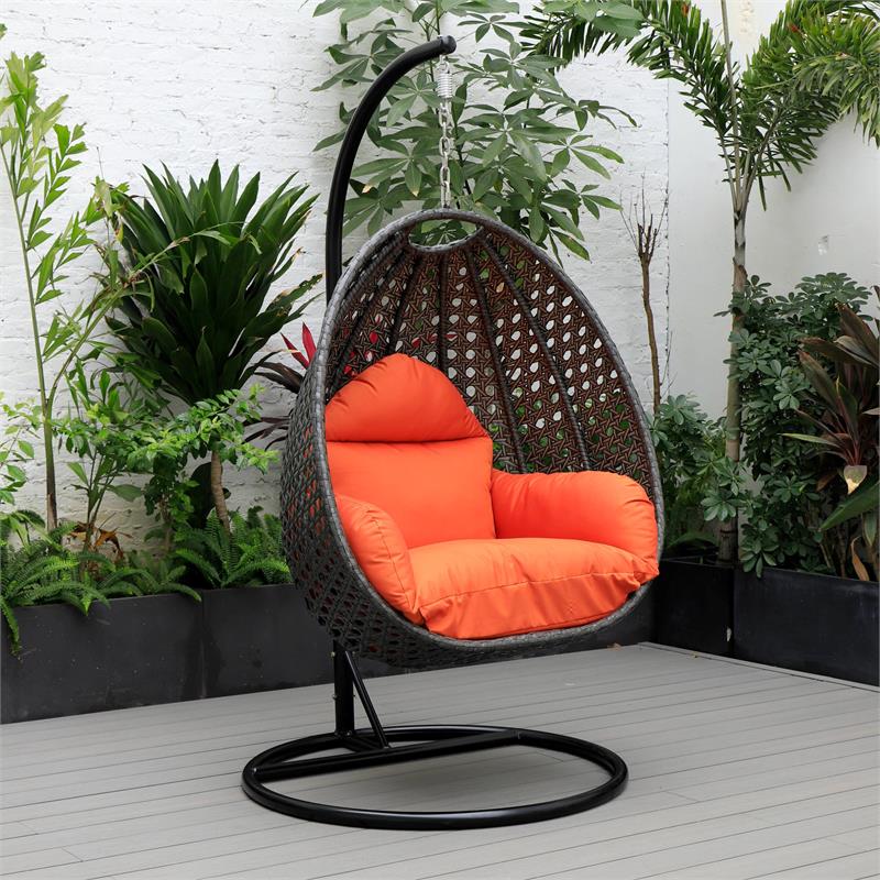LeisureMod Charcoal Wicker Patio Egg Swing Chair with Stand in Orange