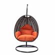 LeisureMod Charcoal Wicker Patio Egg Swing Chair with Stand in Orange