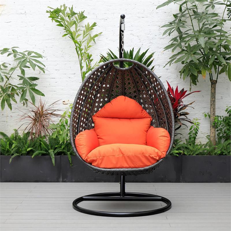 LeisureMod Charcoal Wicker Patio Egg Swing Chair with Stand in Orange