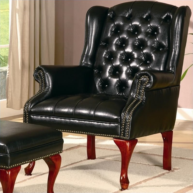 black faux leather chair and ottoman