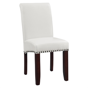 parsons dining chair with antique bronze nail heads in cream faux leather