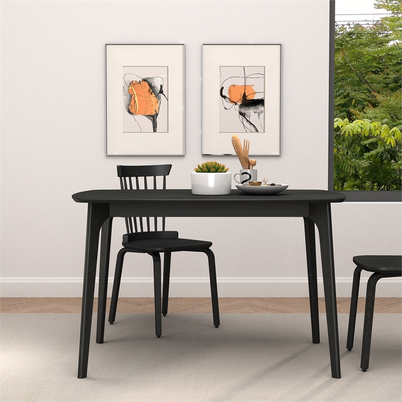 CRO Decor black plywood dining table with curved corners and wood grain desktop