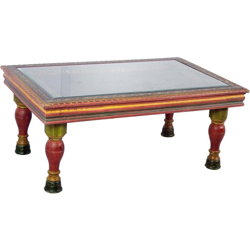 carved wooden coffee table glass top