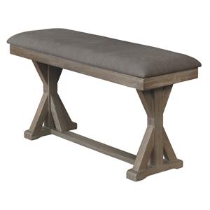 rustic wood counterheight dining bench upholstered with gray linen fabric