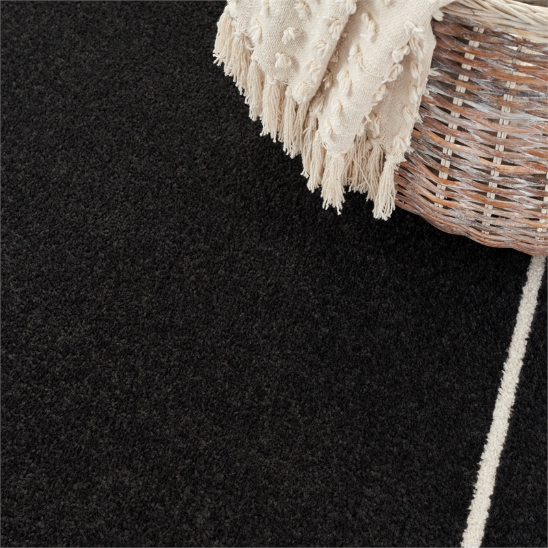 Nourison Essentials 6' x 9' Black Ivory Fabric Contemporary Area Rug