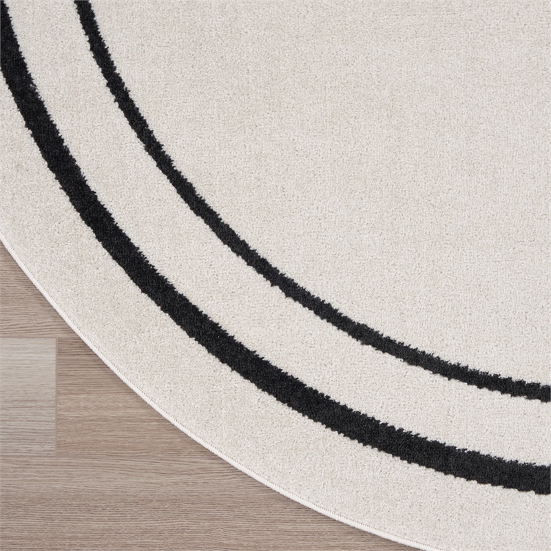 Nourison Essentials 4' x round Ivory/Black Contemporary Indoor/Outdoor Rug