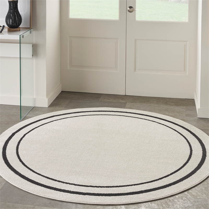 Nourison Essentials 4' x round Ivory/Black Contemporary Indoor/Outdoor Rug