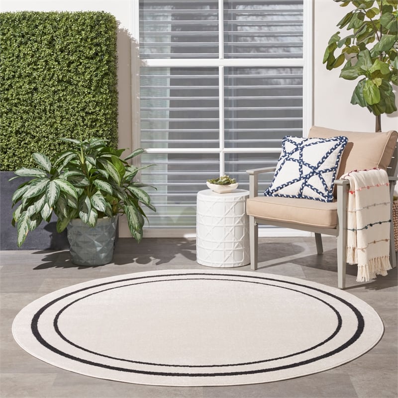Nourison Essentials 4' x round Ivory/Black Contemporary Indoor/Outdoor Rug
