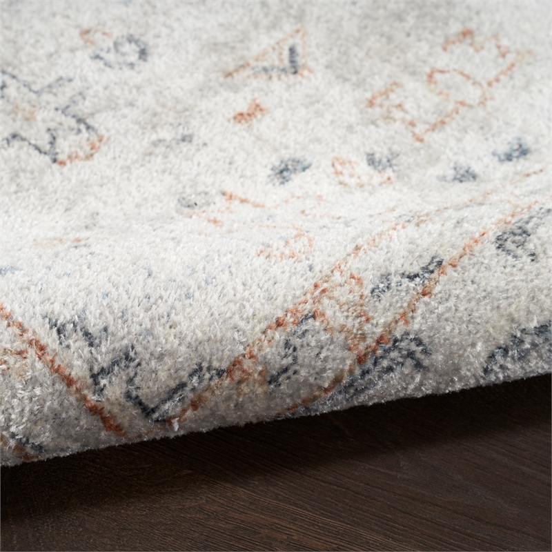 nourison home astra machine washable 9' x 12' light blue fabric area rug