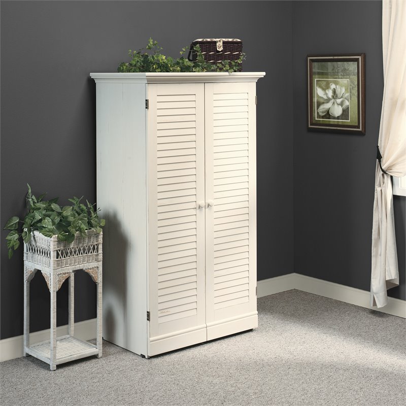 Harbor View Craft Armoire In Antique, Sauder Harbor View Library Bookcase With Doors Antiqued White Finish