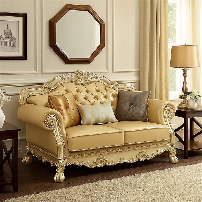 Benjara Traditional Button Tufted Leatherette Loveseat with Carved Details- Gold