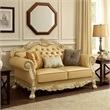Benjara Traditional Button Tufted Leatherette Loveseat with Carved Details- Gold
