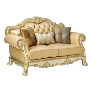 Benjara Traditional Button Tufted Leatherette Loveseat with Carved Details- Gold