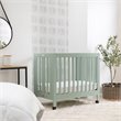 Babyletto Origami Pine Wood Portable Folding Mini Crib with Casters - Light Sage