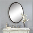 Uttermost Sherise Oval Metal and Glass Wall Mirror in Light Distressed Bronze
