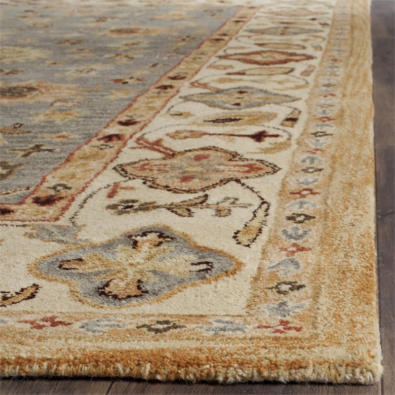 safavieh antiquity 4' x 6' hand tufted wool rug in blue and ivory
