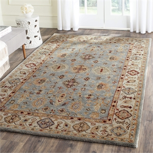 safavieh antiquity 4' x 6' hand tufted wool rug in blue and ivory
