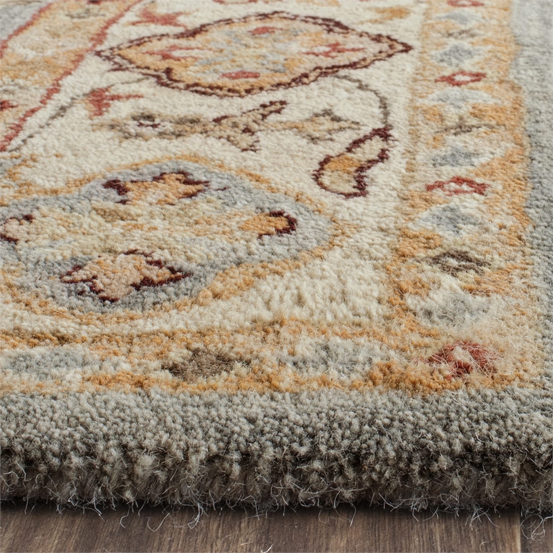 Safavieh Antiquity 6' X 9' Hand Tufted Wool Rug in Blue and Ivory