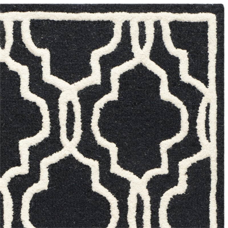safavieh cambridge 2'6&quot x 8' hand tufted wool rug in black and ivory