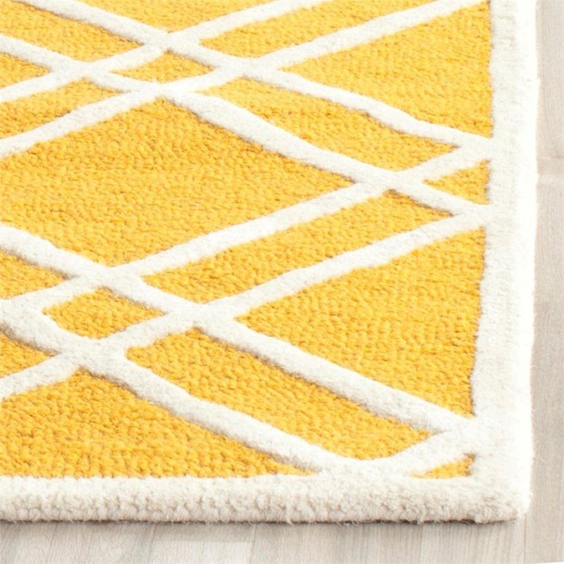 Safavieh Cambridge 5' X 8' Hand Tufted Wool Rug in Gold and Ivory