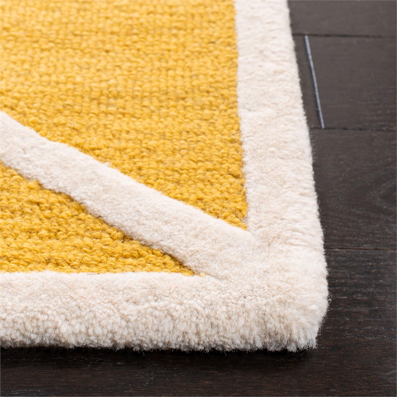 Safavieh Cambridge 5' X 8' Hand Tufted Wool Rug in Gold and Ivory