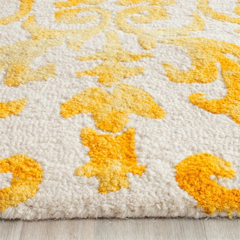 Safavieh Dip Dye 2' X 3' Hand Tufted Rug in Ivory and Gold