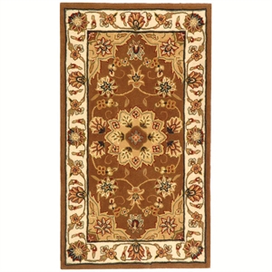 Safavieh Traditions 6' X 9' Hand Tufted Wool Rug in Tan and Ivory
