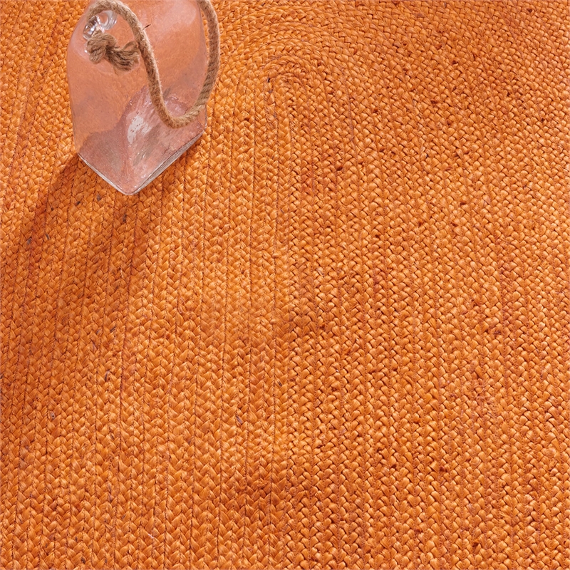 Safavieh Natural Fiber 9' Round Hand Woven Jute Rug in Orange