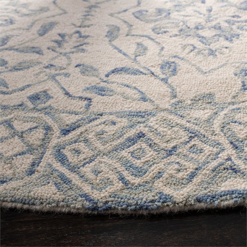 Safavieh Dip Dye 7' Round Hand Tufted Wool Rug in Light Blue and Ivory