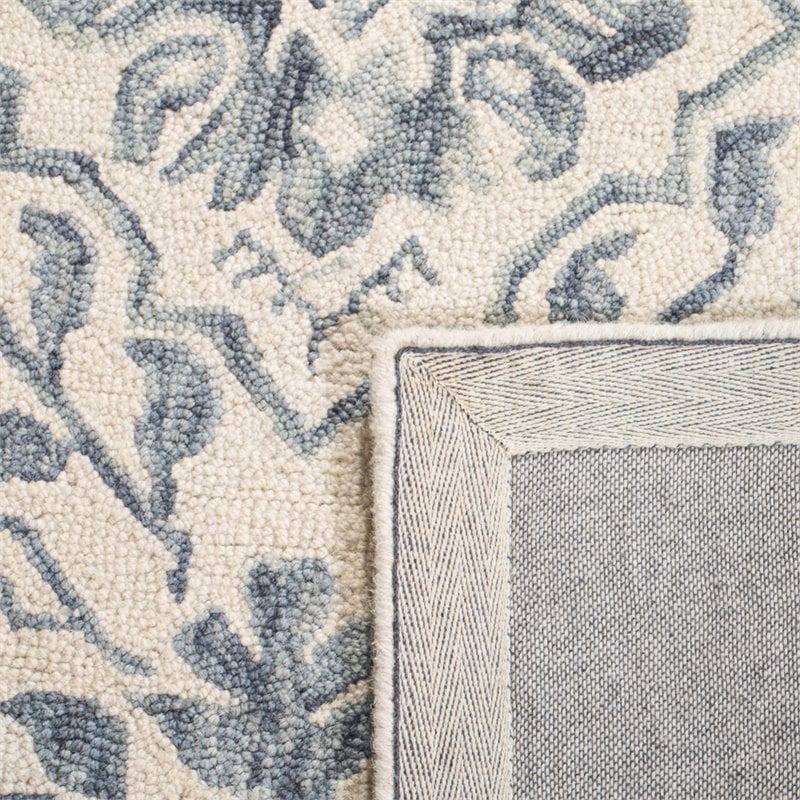 safavieh dip dye 4' x 6' hand tufted wool rug in blue and ivory