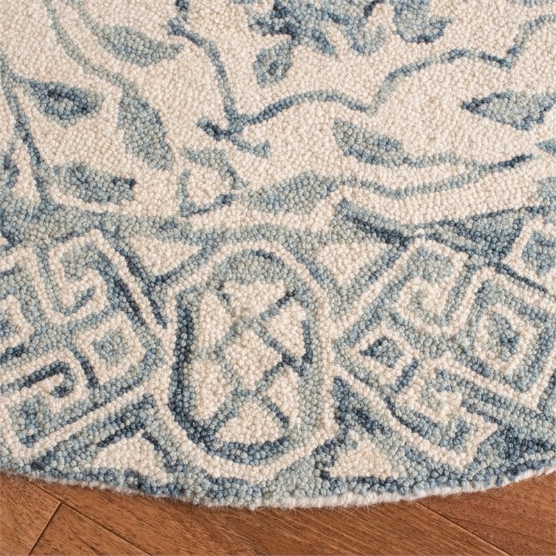 safavieh dip dye 7' round hand tufted wool rug in blue and ivory