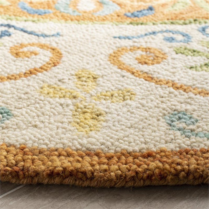 Safavieh Novelty 6' Round Hand Tufted Wool Rug in Gold and Ivory