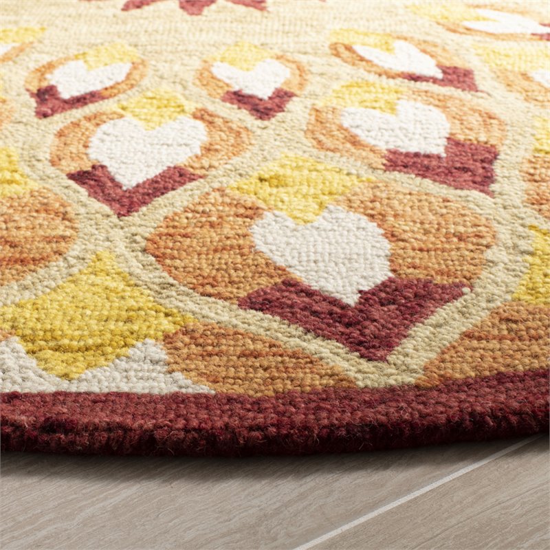 Safavieh Novelty 5' Round Hand Tufted Wool Rug in Rust and Gold