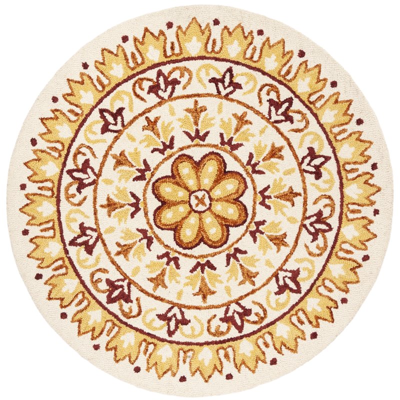 Safavieh Novelty 6' Round Hand Tufted Wool Rug in Ivory and Gold