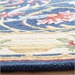 Safavieh Heritage 6' Round Hand Tufted Wool Rug in Navy and Ivory