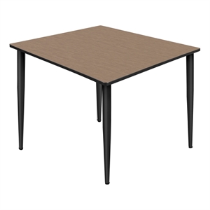 Regency Kahlo 48&quot Square Breakroom Table- Noble Oak Top/Black Tapered Legs