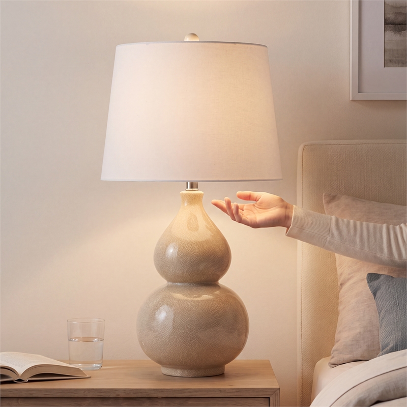 Signature Design by Ashley Saffi Ceramic Table Lamp in Cream