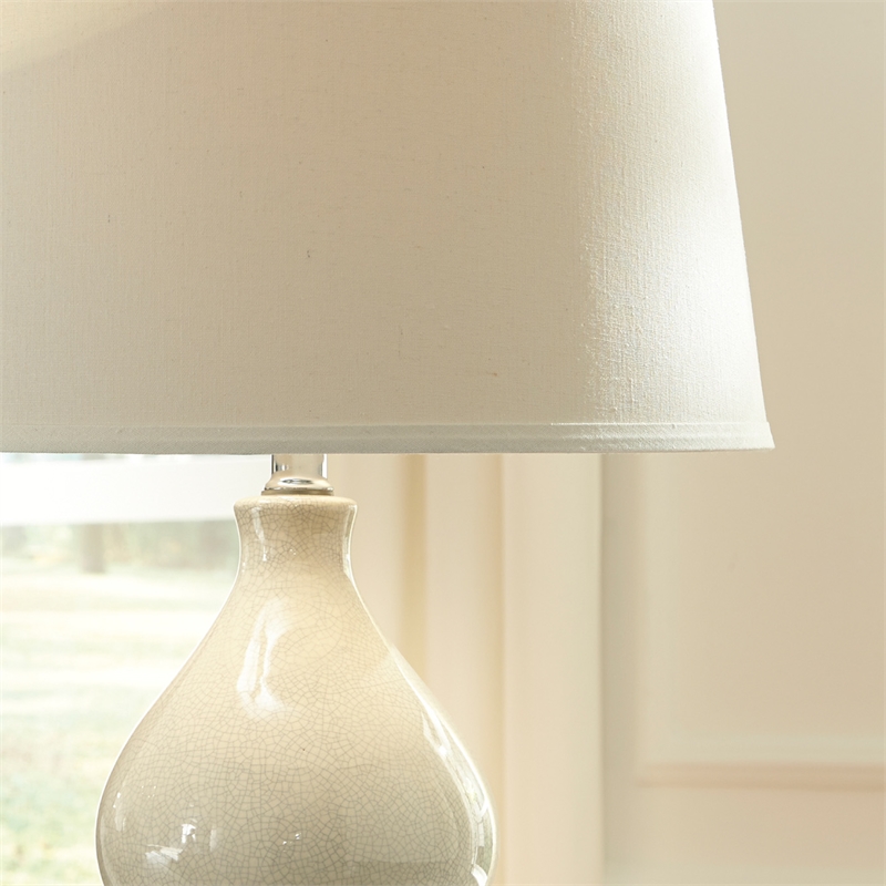 Signature Design by Ashley Saffi Ceramic Table Lamp in Cream
