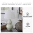 Signature Design by Ashley Saffi Ceramic Table Lamp in Cream