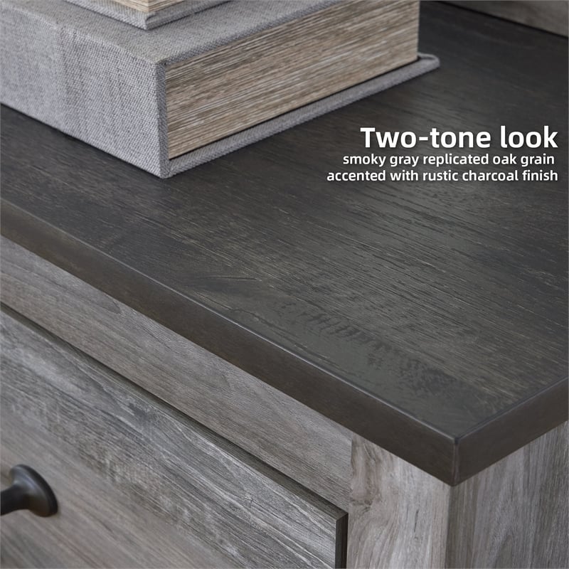 Ashley Furniture Bronyan 4-Drawer Wood Chest in Rustic Charcoal