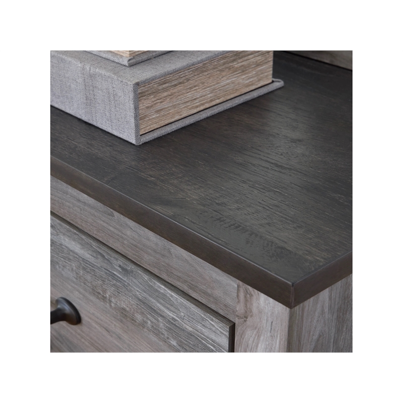 Ashley Furniture Bronyan 4-Drawer Wood Chest in Rustic Charcoal