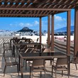 Compamia Capri Resin Patio Dining Arm Chair in Brown