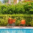 Compamia Dolce Resin Outdoor Arm Chair in Orange